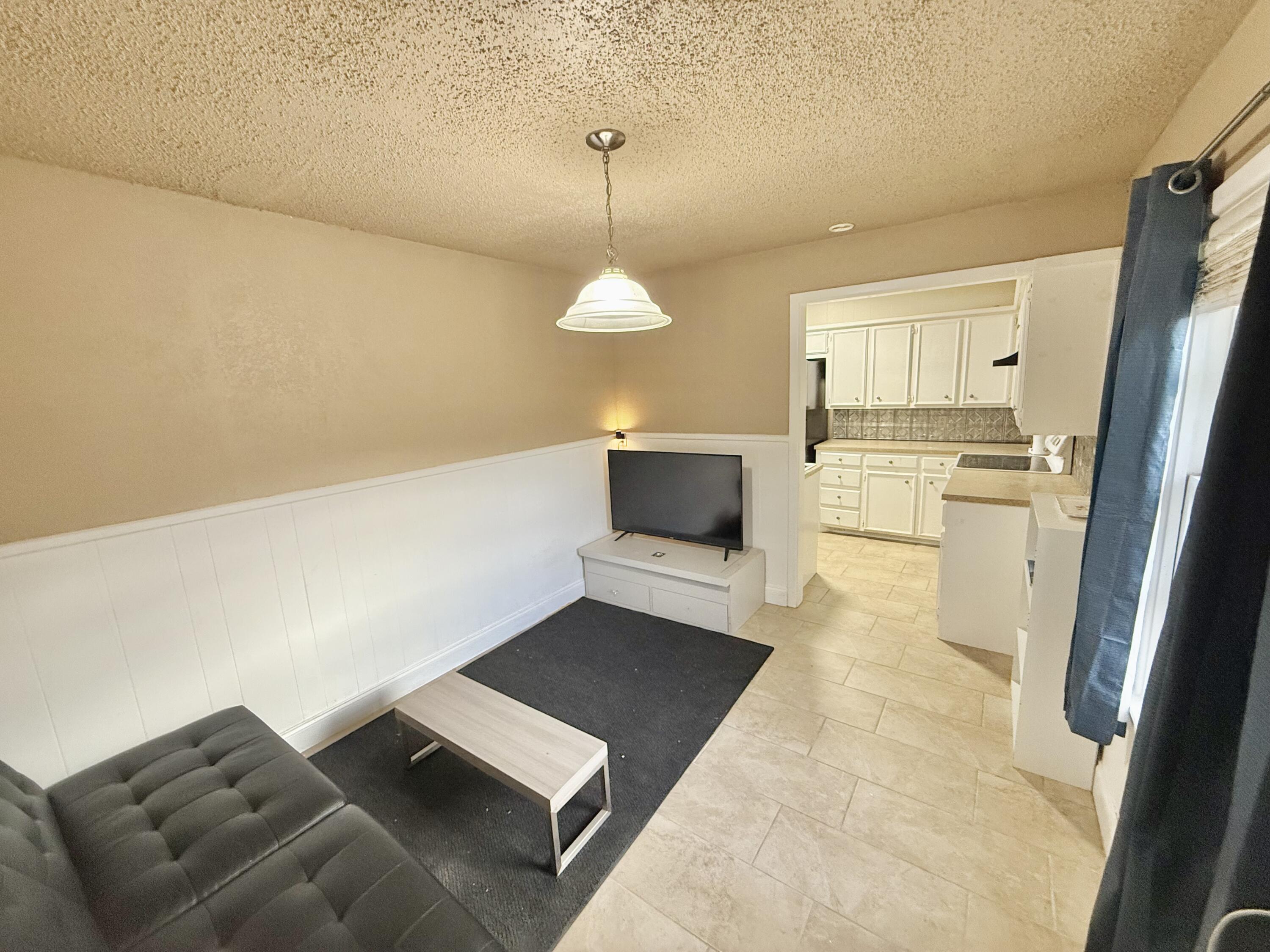 3602 31st Street Lubbock, TX 79410 - Photo 18 of 33 a living room with a couch and a coffee table