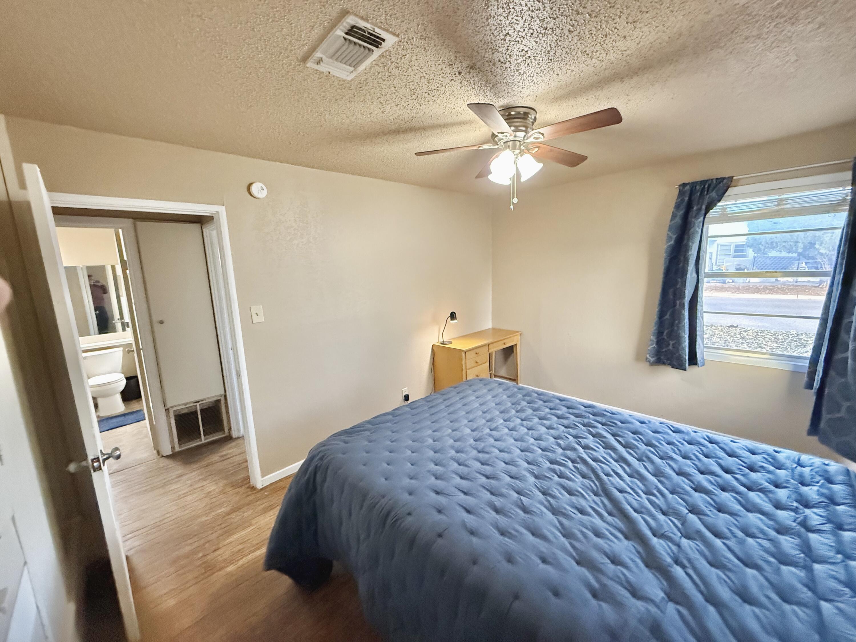 3602 31st Street Lubbock, TX 79410 - Photo 27 of 33 a bedroom with a bed and a window