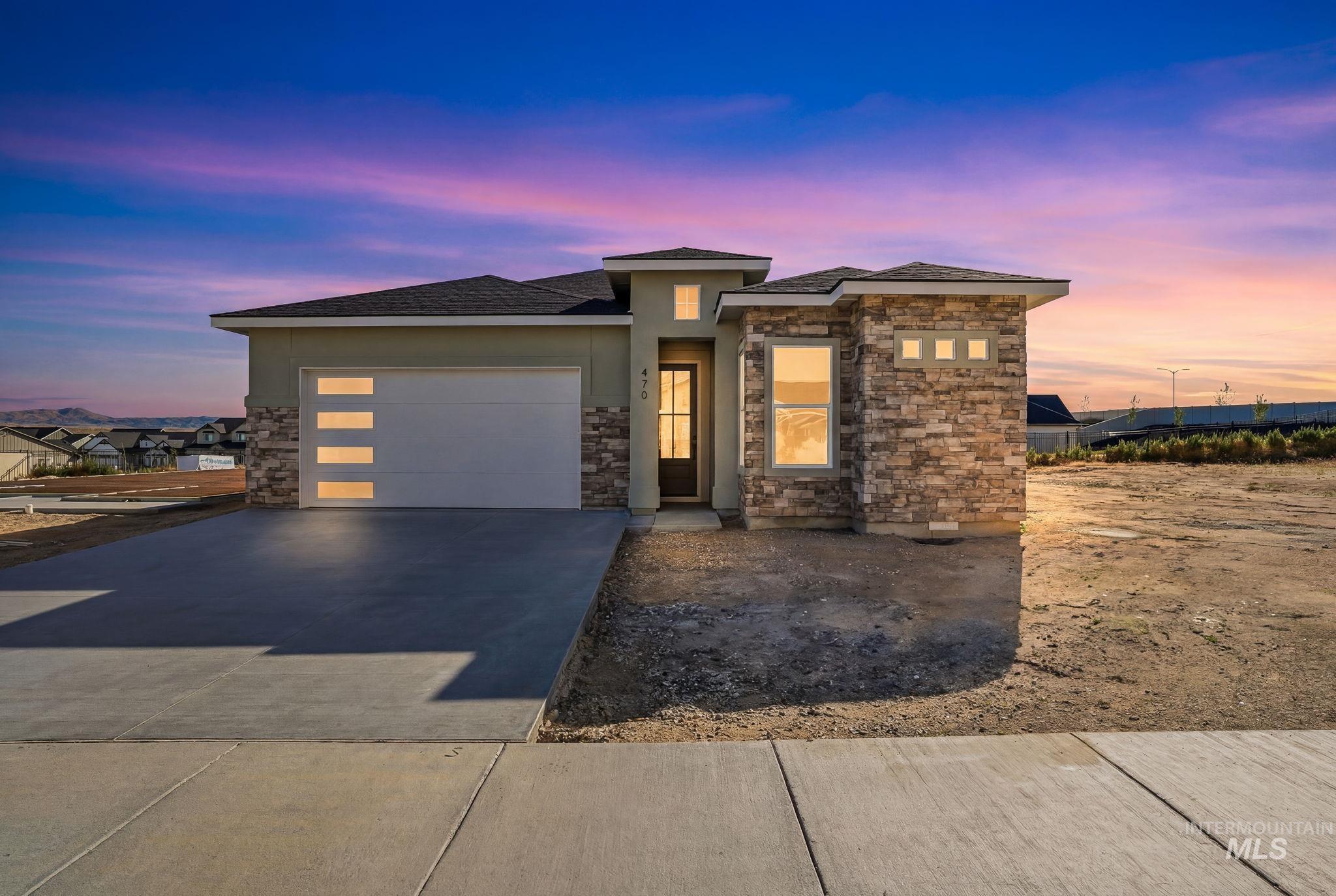 470 South Radiator Way Boise, ID 83716 - Photo 2 of 50 Contemporary exterior with a stone facade, stucco finish, and a dark shingled roof