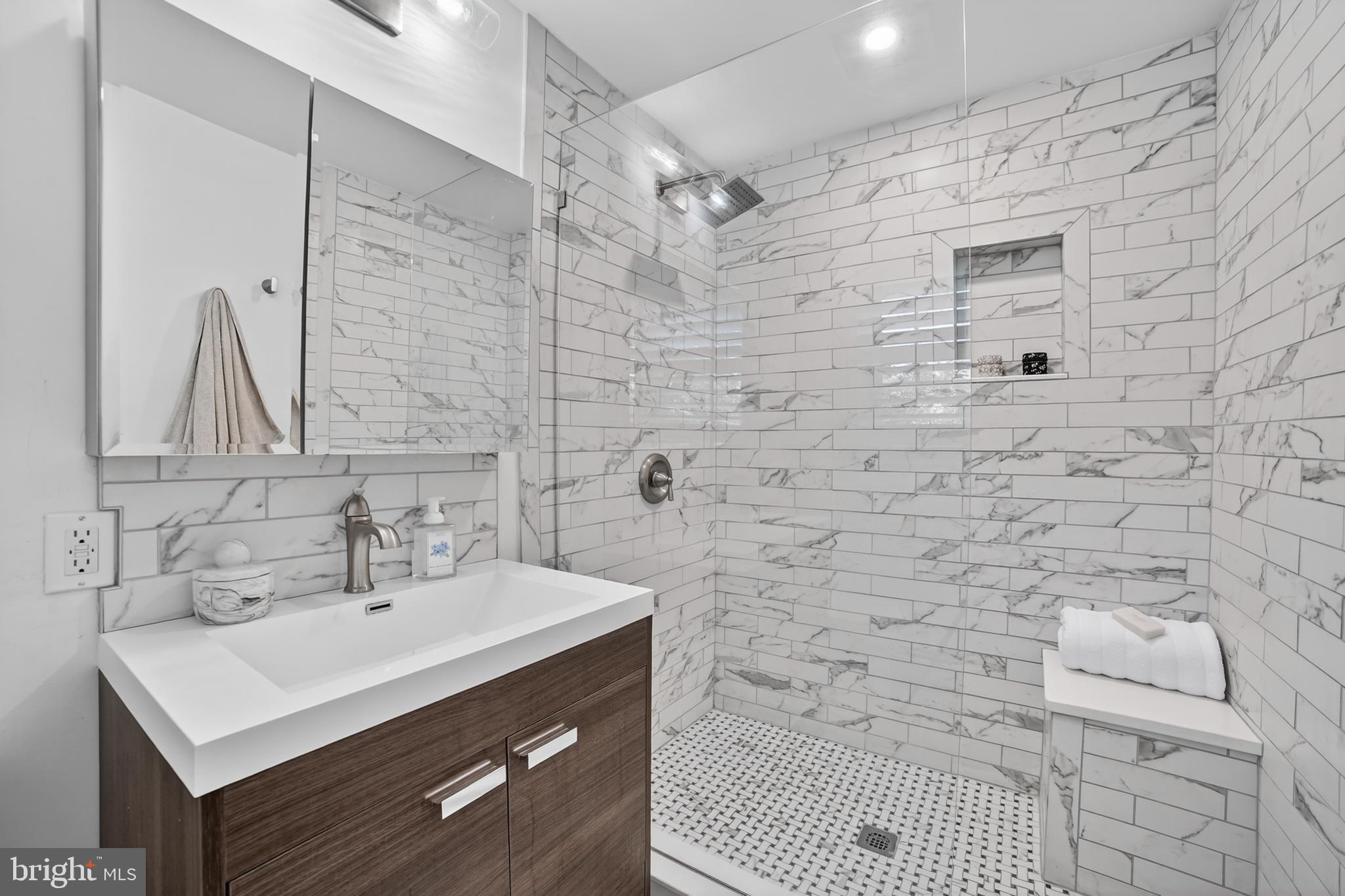 305 Irish Road Berwyn, PA 19312 - Photo 20 of 34 a bathroom with a sink mirror and shower