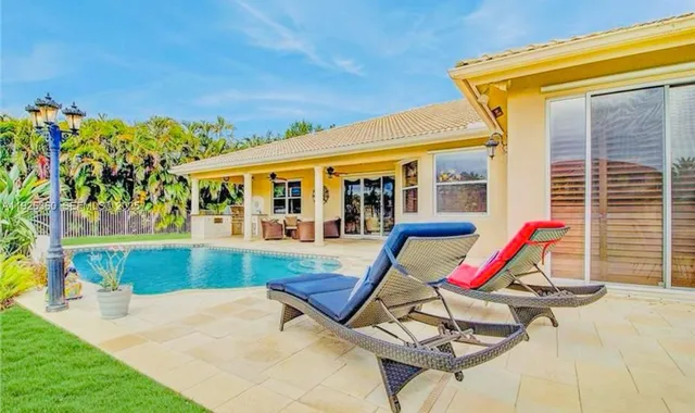 an aerial view of house with yard
