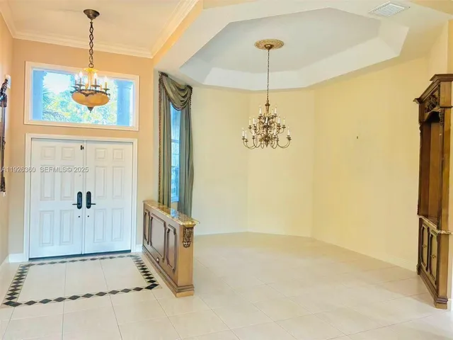 a view of an entryway and livingroom with furniture