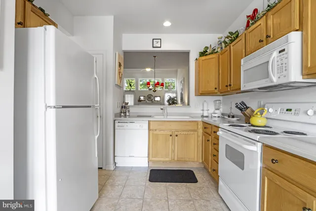 a view of a dining room with furniture and a chandelier