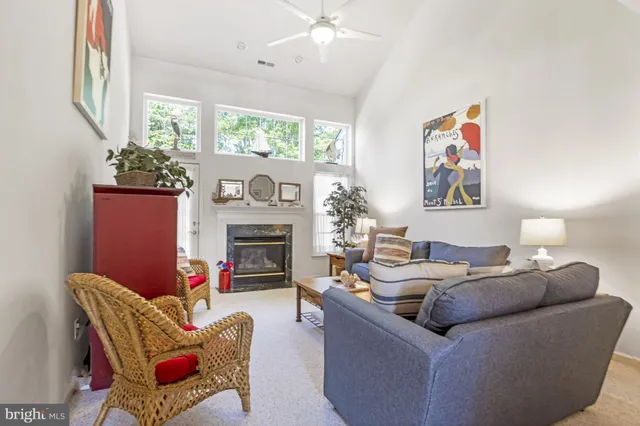 a living room with furniture and a lamp