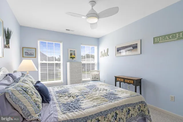 an aerial view of a house with garden space and street view