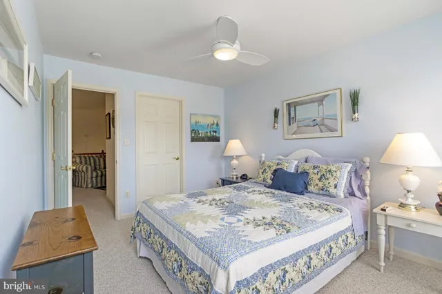 an aerial view of residential houses with outdoor space and street view