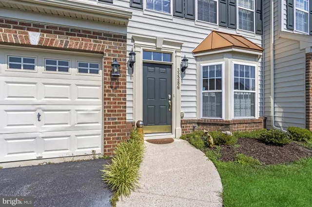 a kitchen with stainless steel appliances a refrigerator sink and cabinets