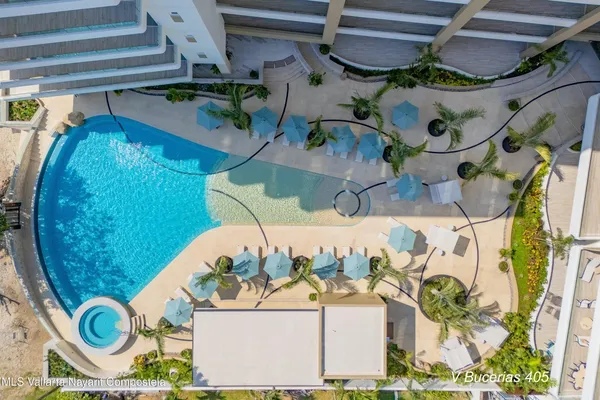 a view of yard with swimming pool and sitting area