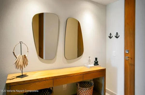 a kitchen with stainless steel appliances kitchen island granite countertop a stove a sink and a refrigerator