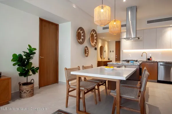 a living room with furniture a lamp and a dining table