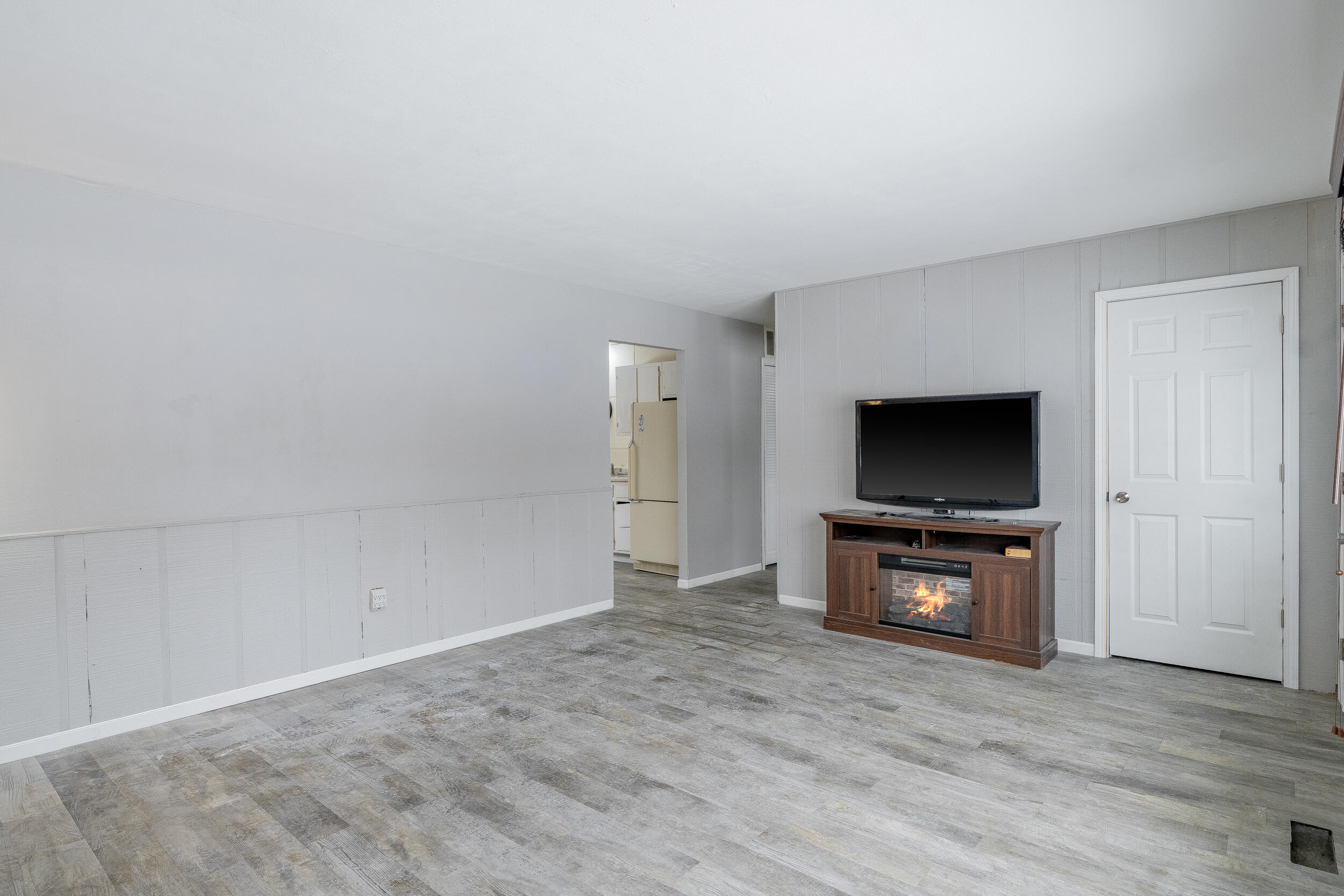 419 Portland Road Valparaiso, IN 46385 - Photo 5 of 21 a view of a livingroom with furniture and a flat screen tv