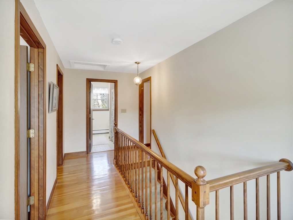 15 Riverside Drive Mansfield, MA 02048 - Photo 27 of 42 a view of a hallway with wooden floor and stairs
