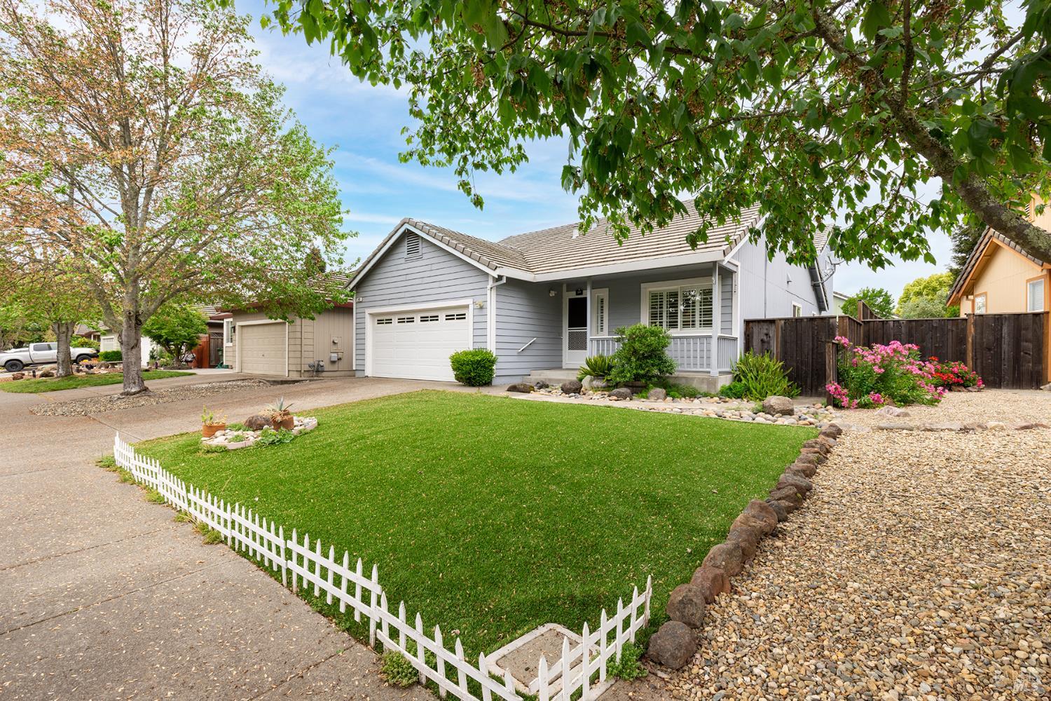 349 Sugar Maple Lane Windsor, CA 95492 - Photo 2 of 47 a front view of a house with a garden and plants