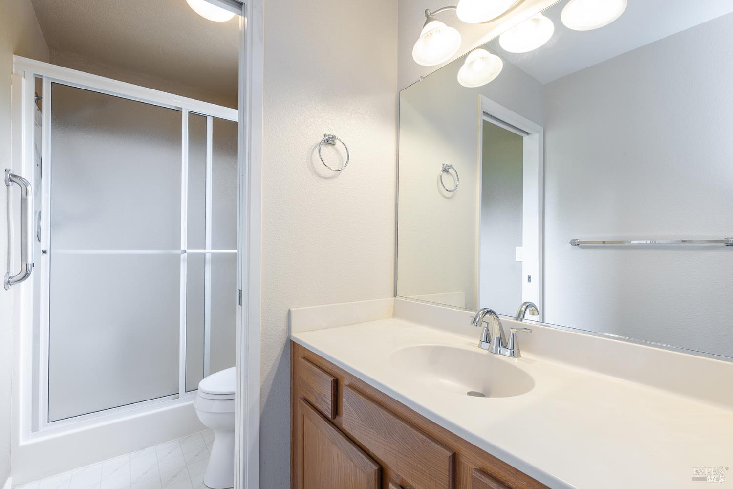 349 Sugar Maple Lane Windsor, CA 95492 - Photo 35 of 47 a bathroom with a granite countertop sink toilet and shower