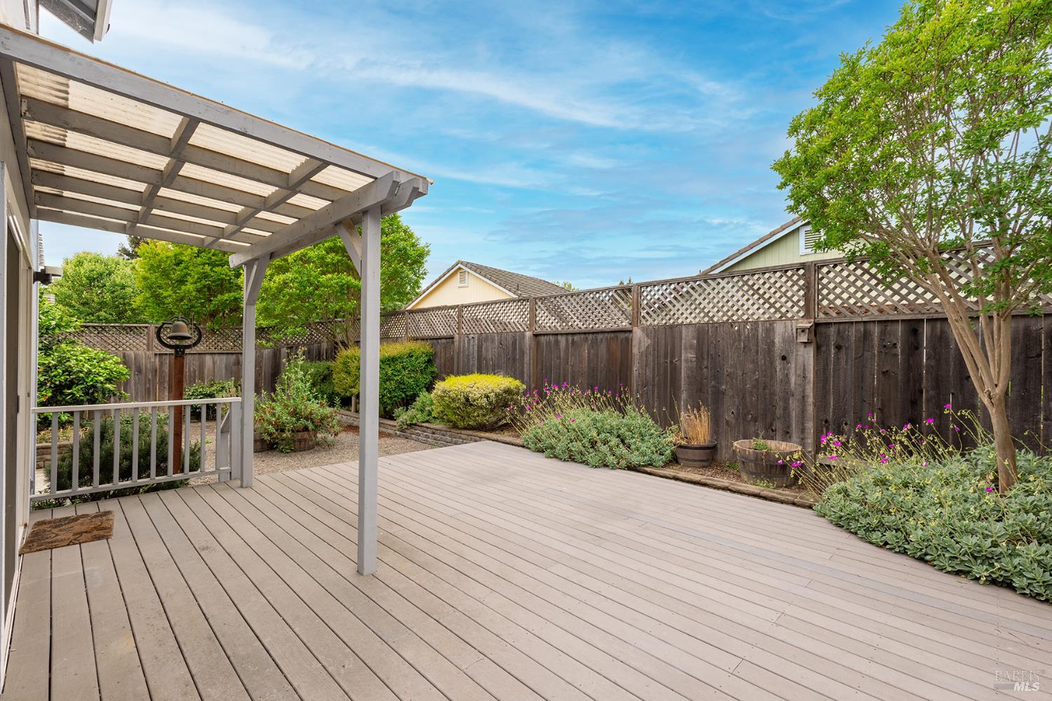 349 Sugar Maple Lane Windsor, CA 95492 - Photo 37 of 47 a view of a patio with table and chairs a barbeque with wooden floor and fence
