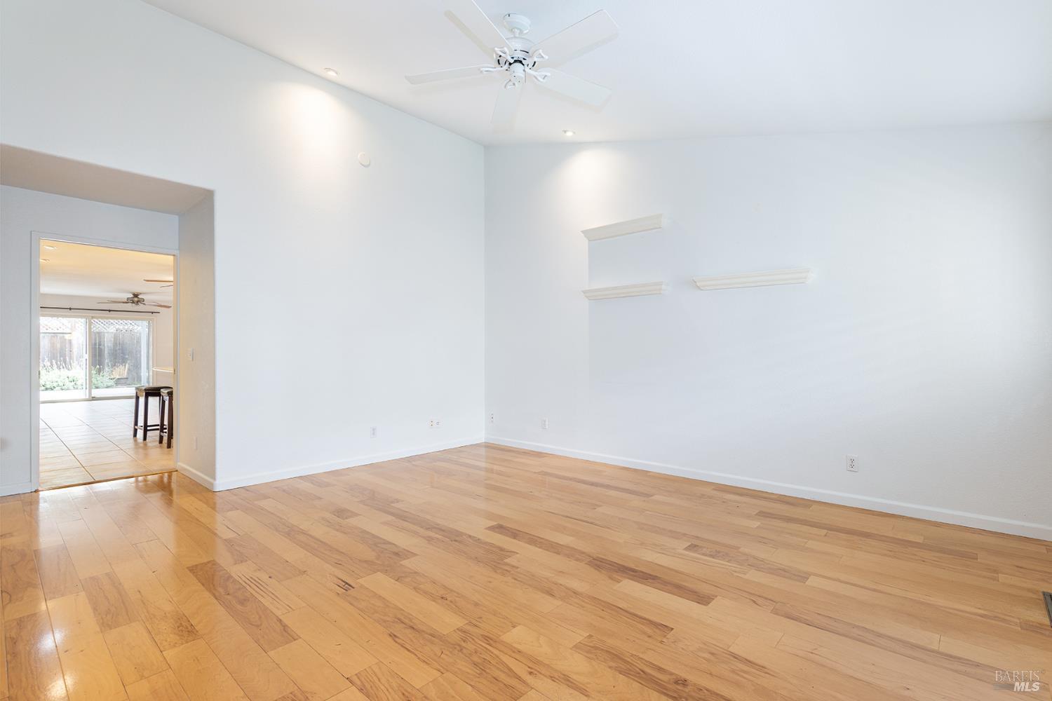 349 Sugar Maple Lane Windsor, CA 95492 - Photo 6 of 47 a view of empty room with wooden floor and fan