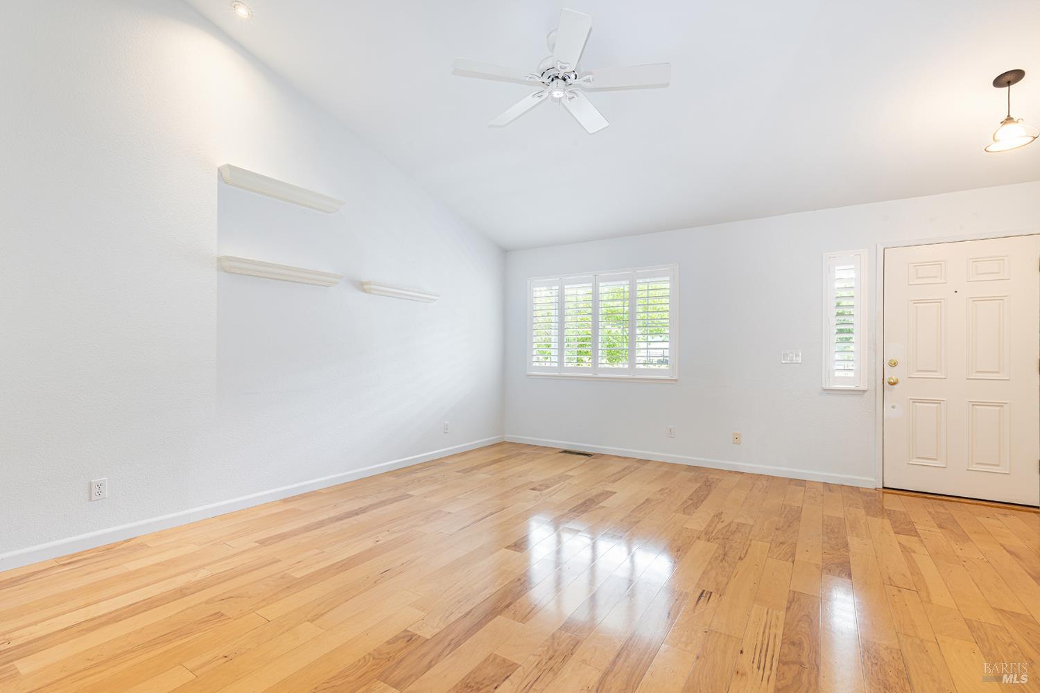 349 Sugar Maple Lane Windsor, CA 95492 - Photo 9 of 47 wooden floor in an empty room with a window