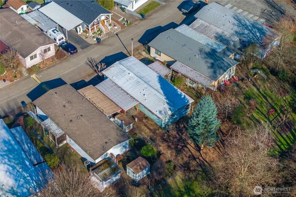 an aerial view of a house with a yard