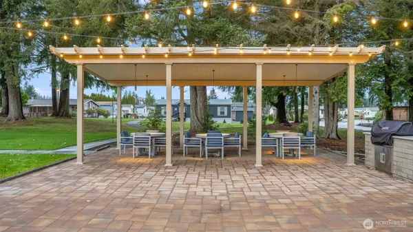 a outdoor space with a couch and chairs