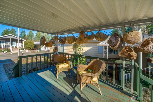 a patio with wooden furniture and patio