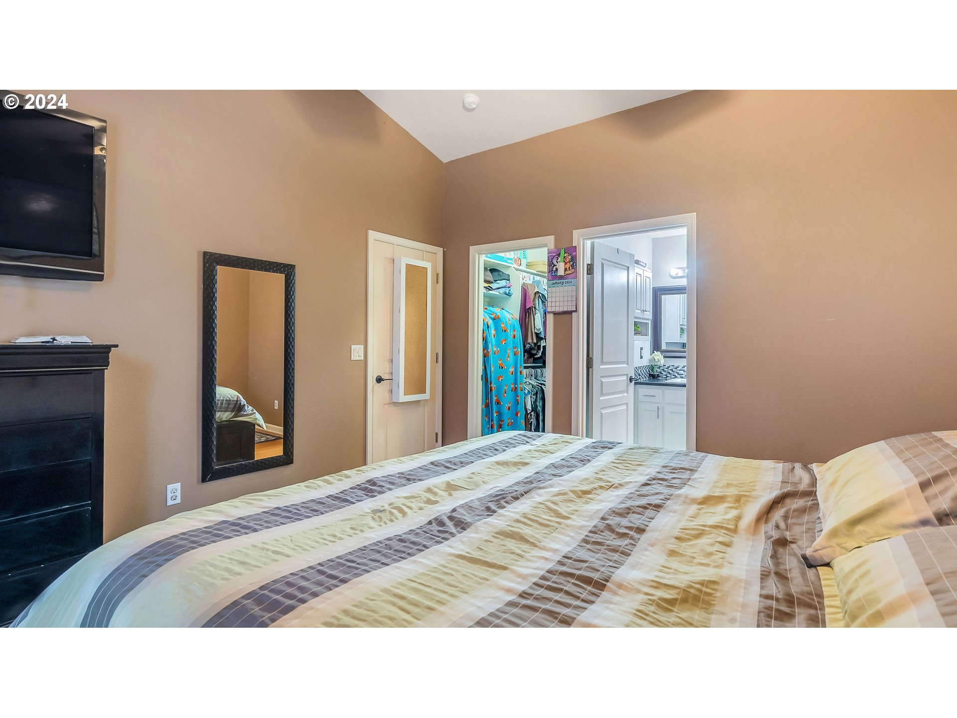 4688 Swegle Road Northeast Salem, OR 97301 - Photo 11 of 18 a bedroom with a bed and a flat screen tv