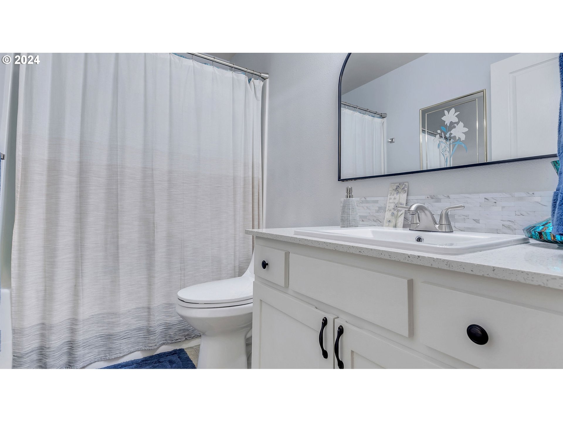 4688 Swegle Road Northeast Salem, OR 97301 - Photo 15 of 18 a bathroom with a sink a toilet and a mirror