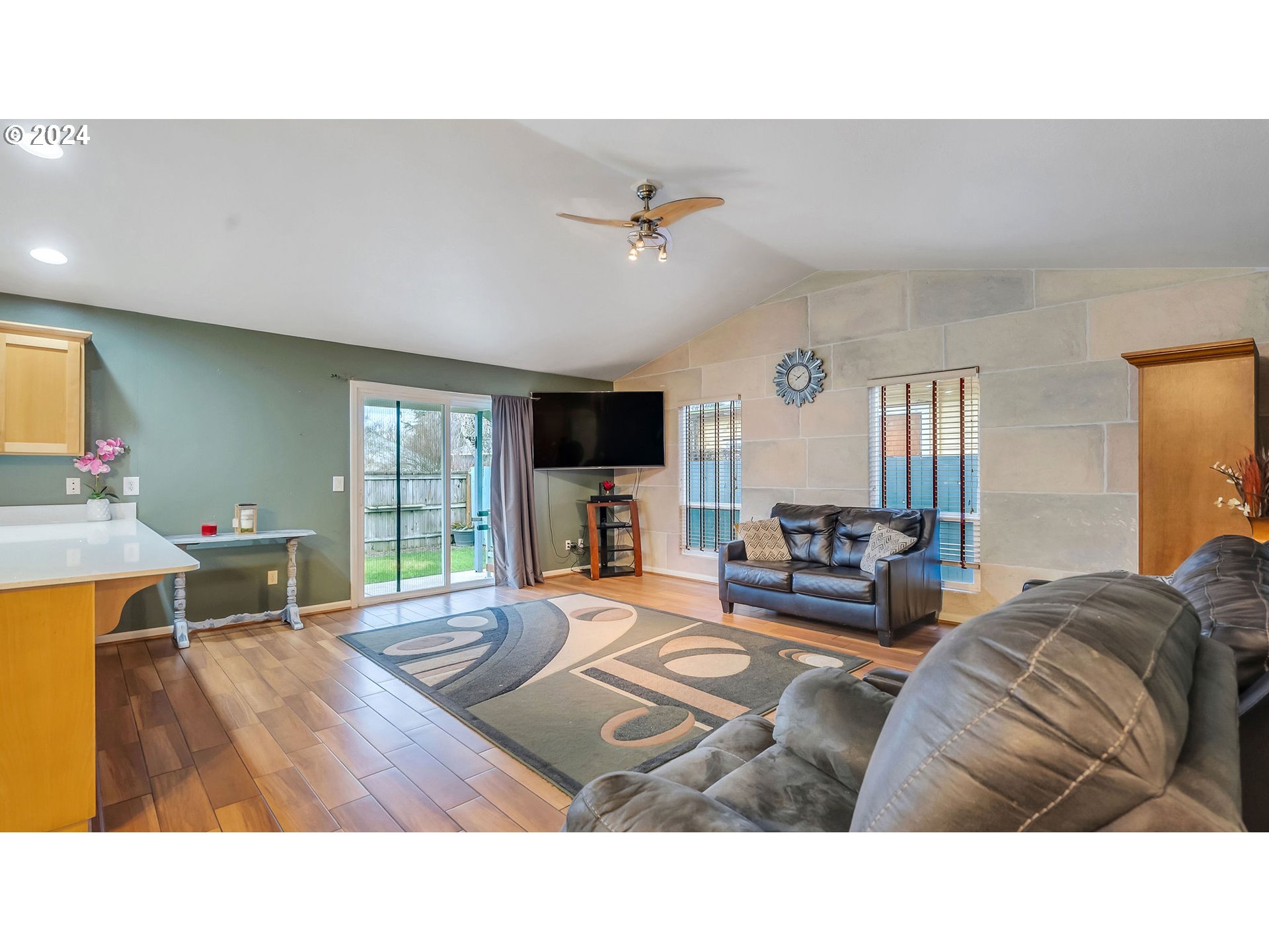 4688 Swegle Road Northeast Salem, OR 97301 - Photo 5 of 18 a living room with furniture and a flat screen tv