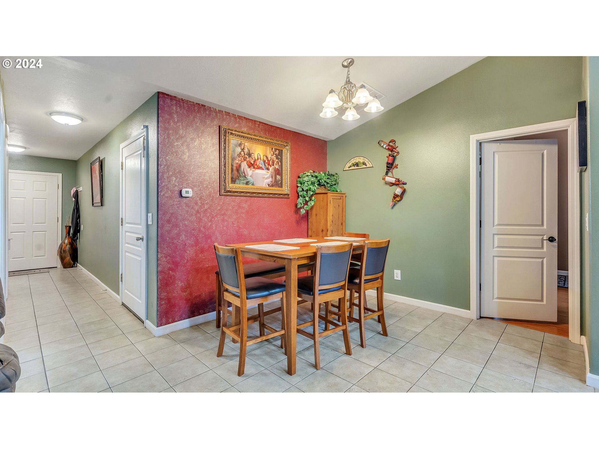 4688 Swegle Road Northeast Salem, OR 97301 - Photo 8 of 18 a dining room with furniture and chandelier