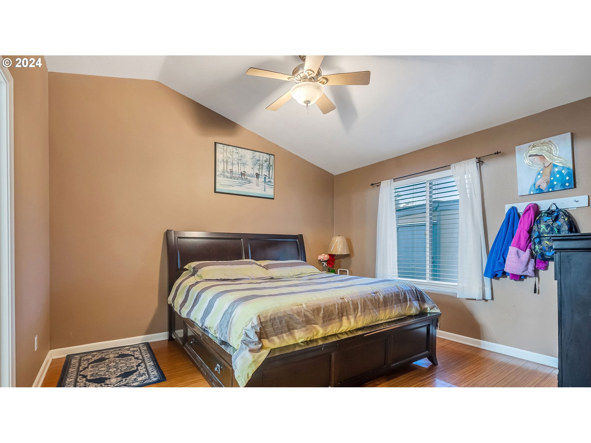 4688 Swegle Road Northeast Salem, OR 97301 - Photo 9 of 18 a bedroom with a bed and a chandelier