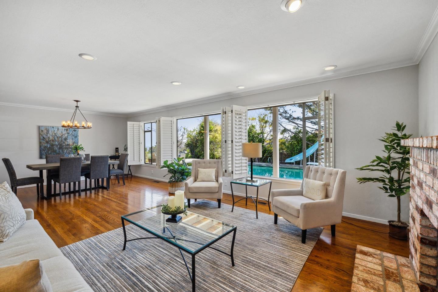 1245 Encina Drive Millbrae, CA 94030 - Photo 13 of 100 a living room with furniture and a potted plant