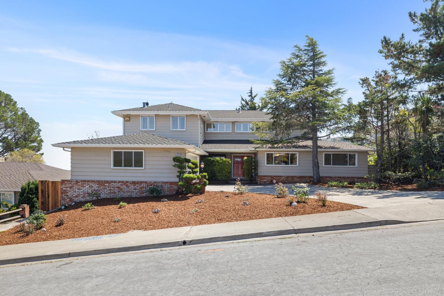 1245 Encina Drive Millbrae, CA 94030 - Photo 2 of 100 a front view of a house with a yard
