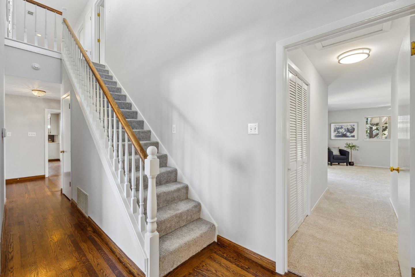 1245 Encina Drive Millbrae, CA 94030 - Photo 36 of 100 a view of a hallway with wooden floor and entryway