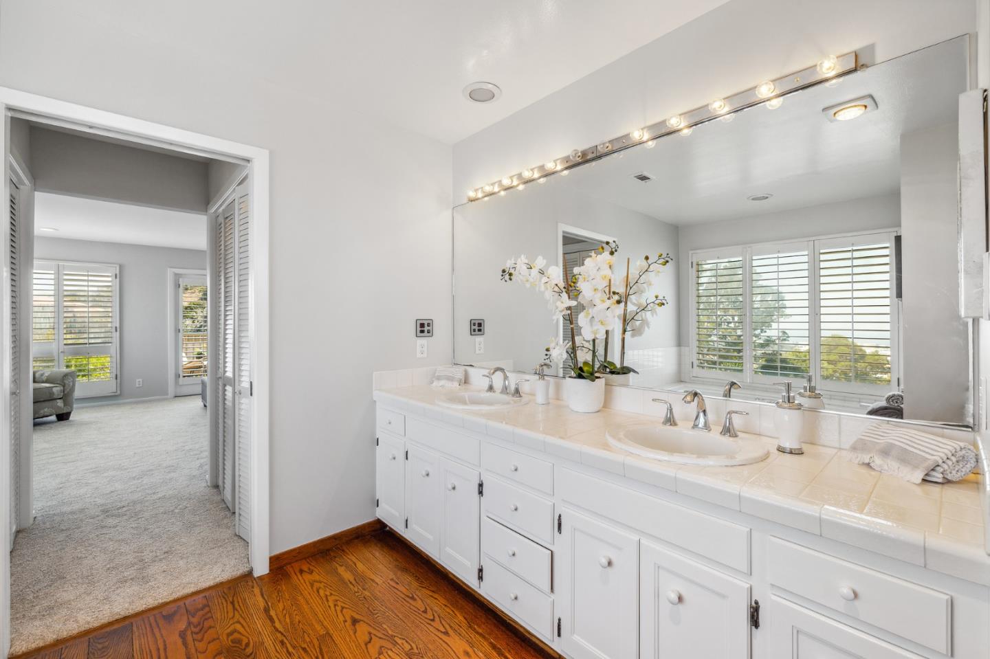 1245 Encina Drive Millbrae, CA 94030 - Photo 52 of 100 a spacious bathroom with a double vanity sink mirror and next to a window