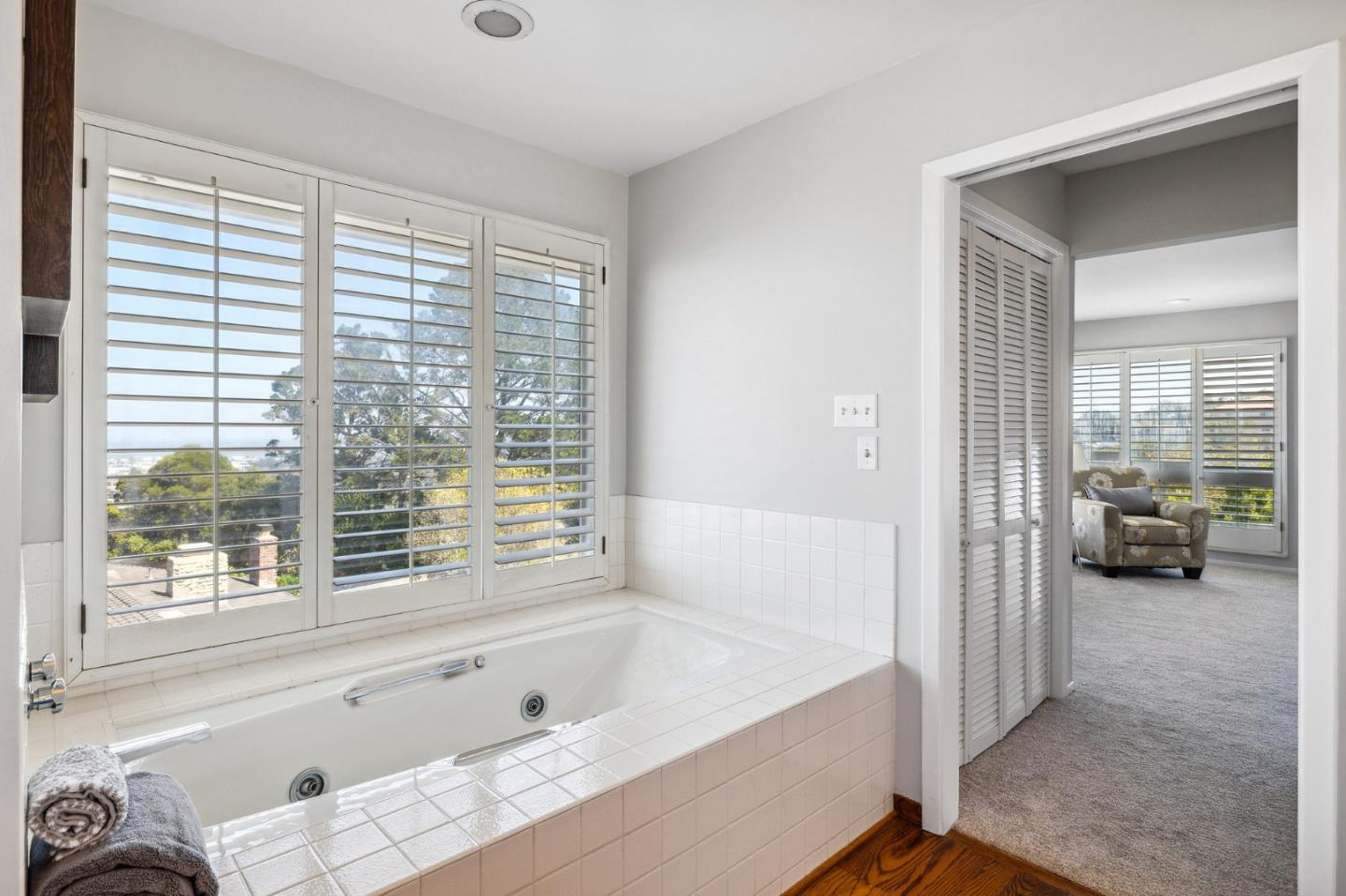 1245 Encina Drive Millbrae, CA 94030 - Photo 53 of 100 a bathroom with a tub and a large window