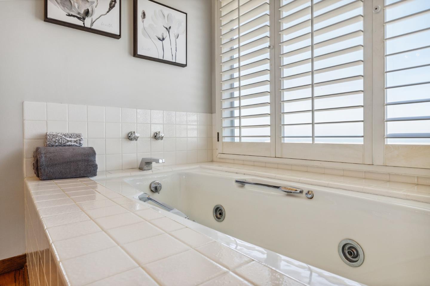 1245 Encina Drive Millbrae, CA 94030 - Photo 54 of 100 a bathroom with a bathtub and next to a window