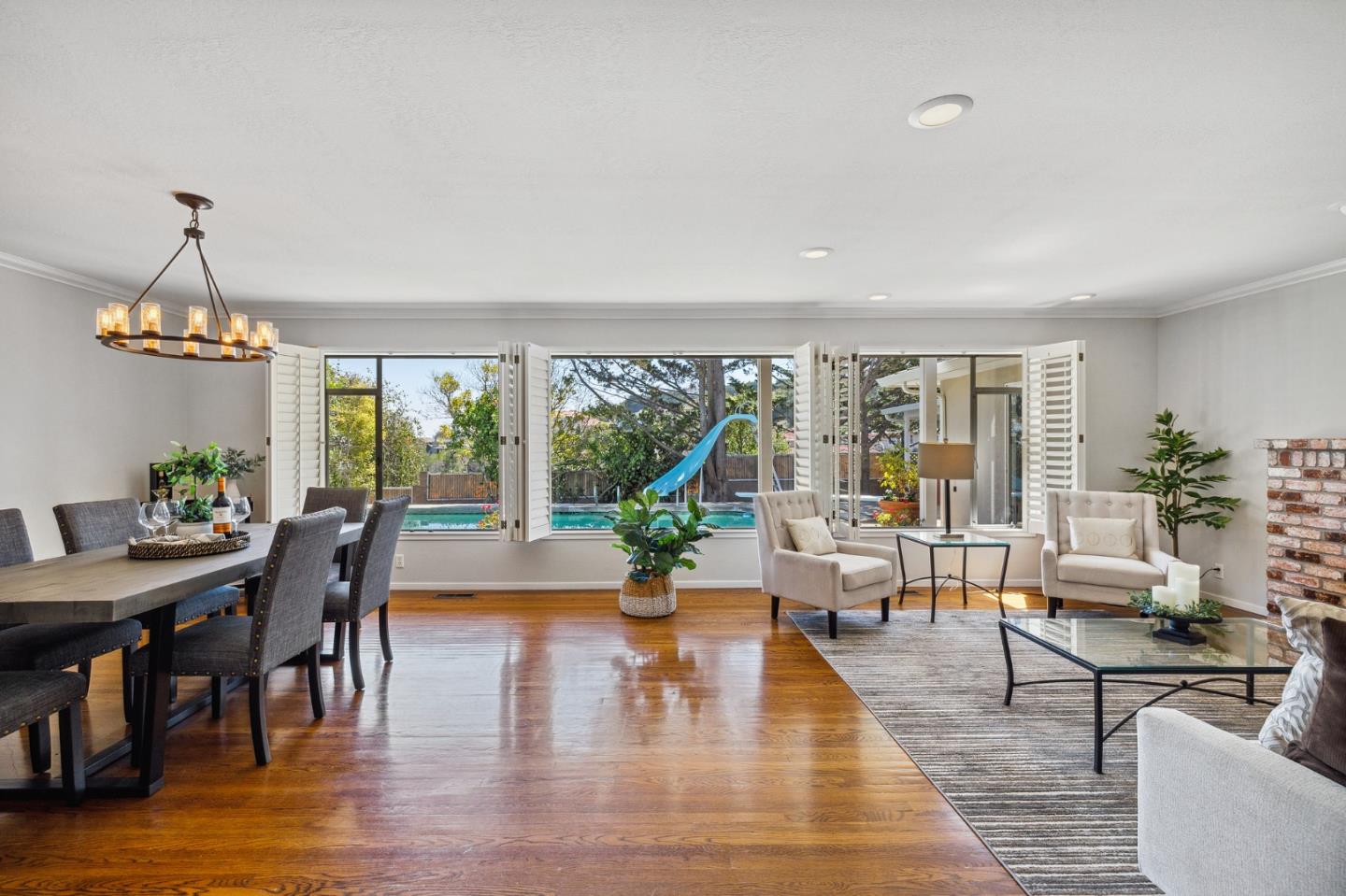 1245 Encina Drive Millbrae, CA 94030 - Photo 8 of 100 a living room with furniture wooden floor and a floor to ceiling window