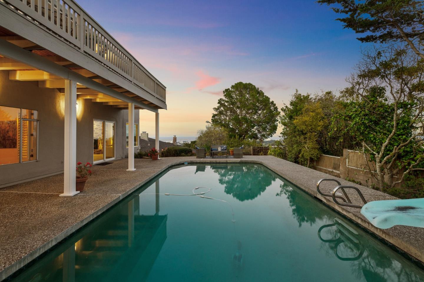1245 Encina Drive Millbrae, CA 94030 - Photo 96 of 100 a view of a swimming pool with a lounge chair