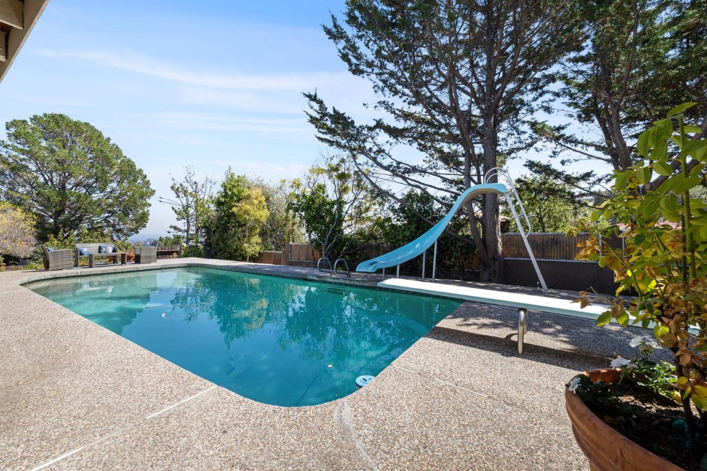 1245 Encina Drive Millbrae, CA 94030 - Photo 98 of 100 a view of a swimming pool with a yard