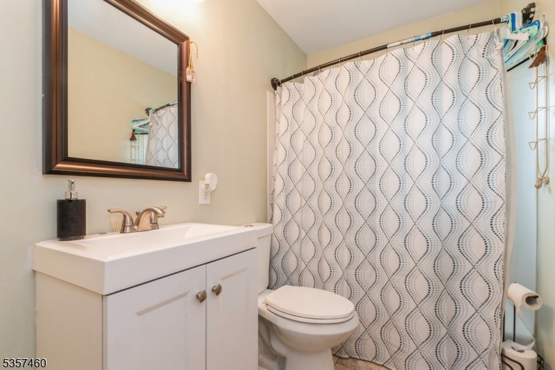 8 Millbrook Road Washington, NJ 07882 - Photo 11 of 24 a bathroom with a toilet sink and mirror