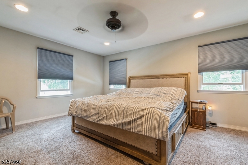 8 Millbrook Road Washington, NJ 07882 - Photo 12 of 24 a bedroom with a bed and a ceiling fan