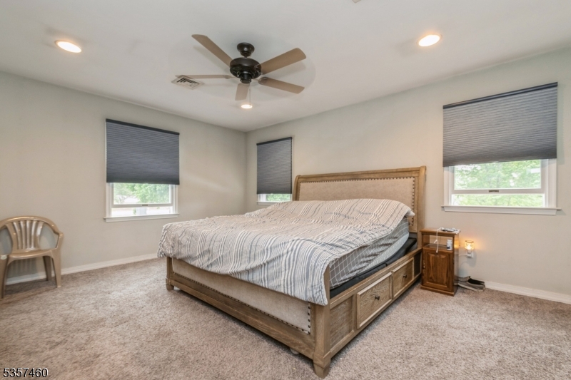 8 Millbrook Road Washington, NJ 07882 - Photo 13 of 24 a bed sitting in a bedroom next to a window
