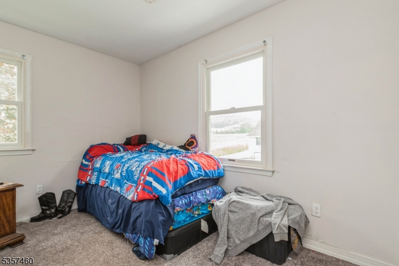 8 Millbrook Road Washington, NJ 07882 - Photo 14 of 24 a bedroom with a bed and a window