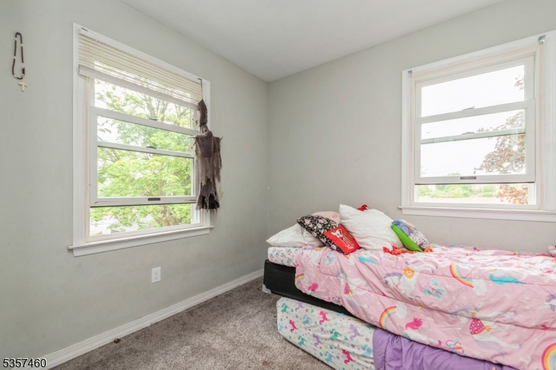8 Millbrook Road Washington, NJ 07882 - Photo 15 of 24 a bedroom with a bed and a window