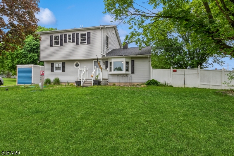 8 Millbrook Road Washington, NJ 07882 - Photo 2 of 24 a front view of a house with a yard and trees