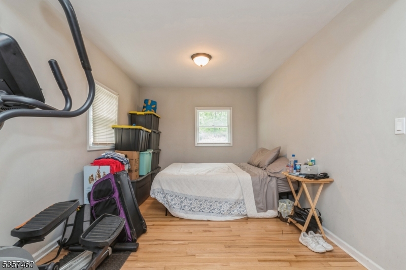 8 Millbrook Road Washington, NJ 07882 - Photo 10 of 24 a room with gym equipment and wooden floor