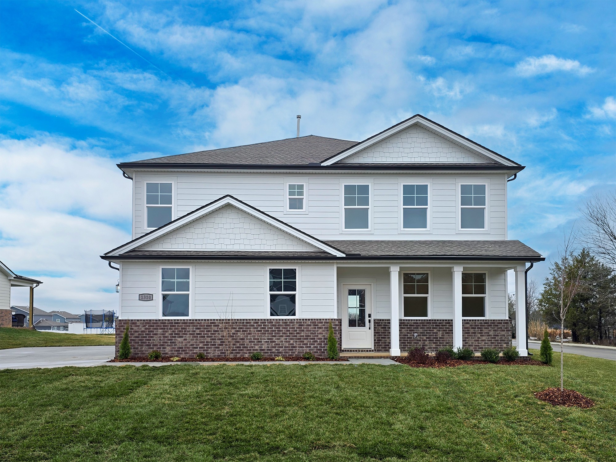 front view of a house with a yard