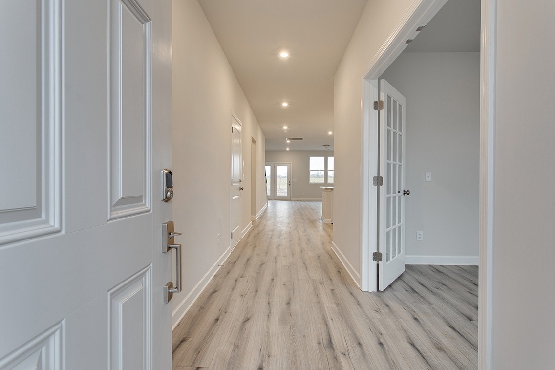 1310 Kristopher Drive Lebanon, TN 37087 - Photo 6 of 36 a view of a hallway with wooden floor