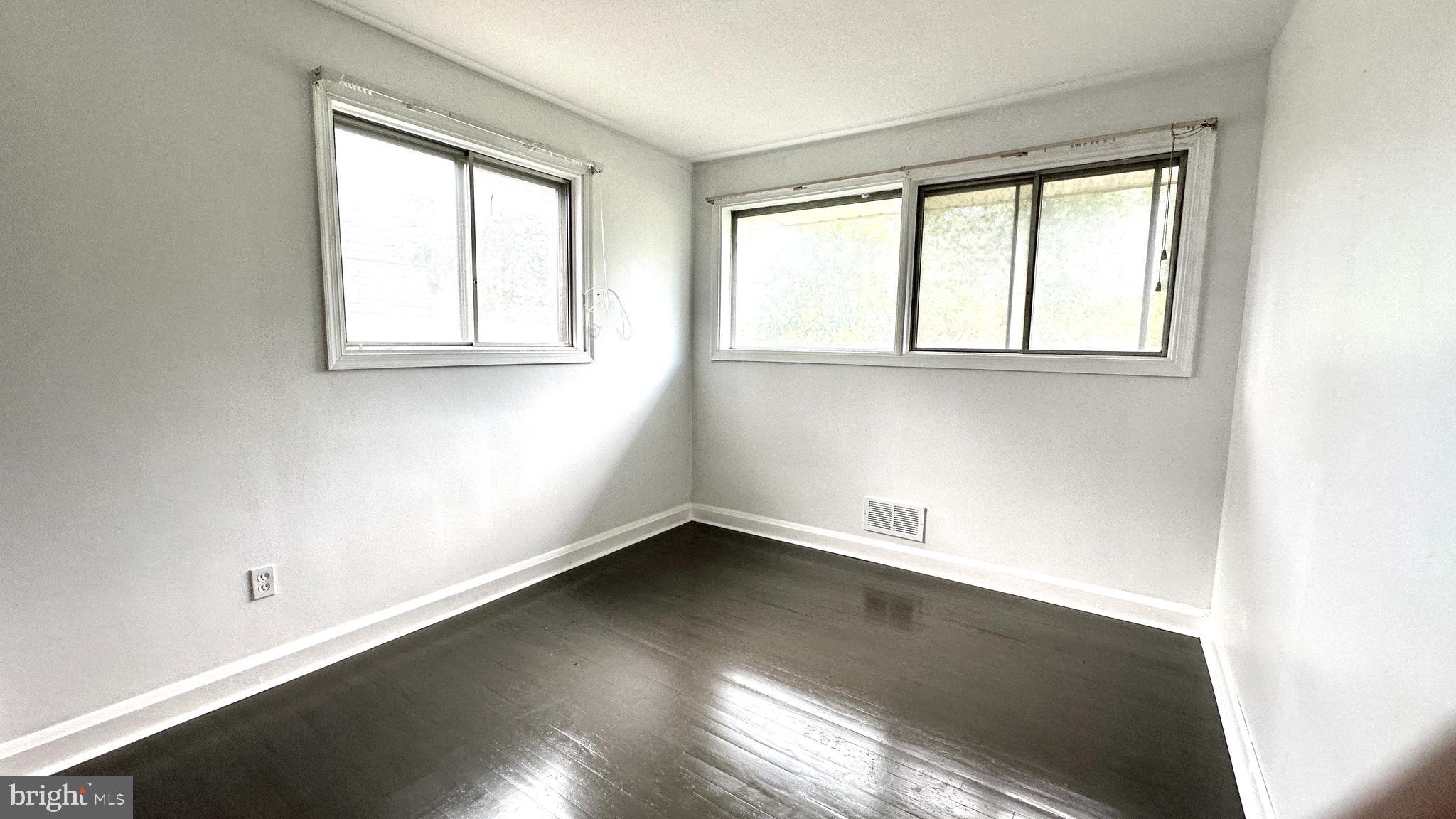 37 Othoridge Road Lutherville-Timonium, MD 21093 - Photo 23 of 38 an empty room with wooden floor and windows