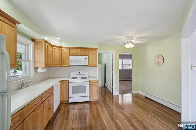 a kitchen with a sink stove and refrigerator