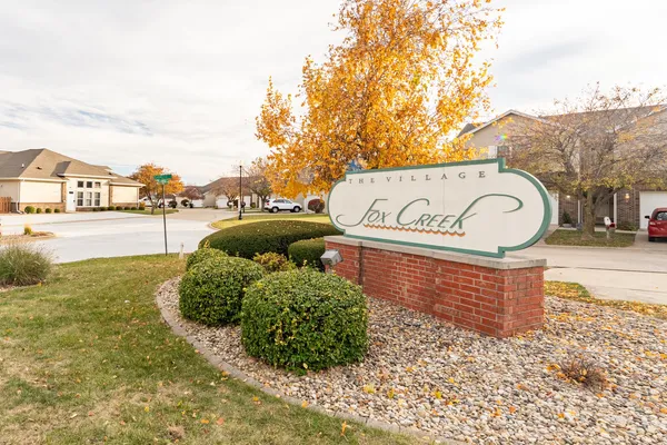 a sign board with parking space